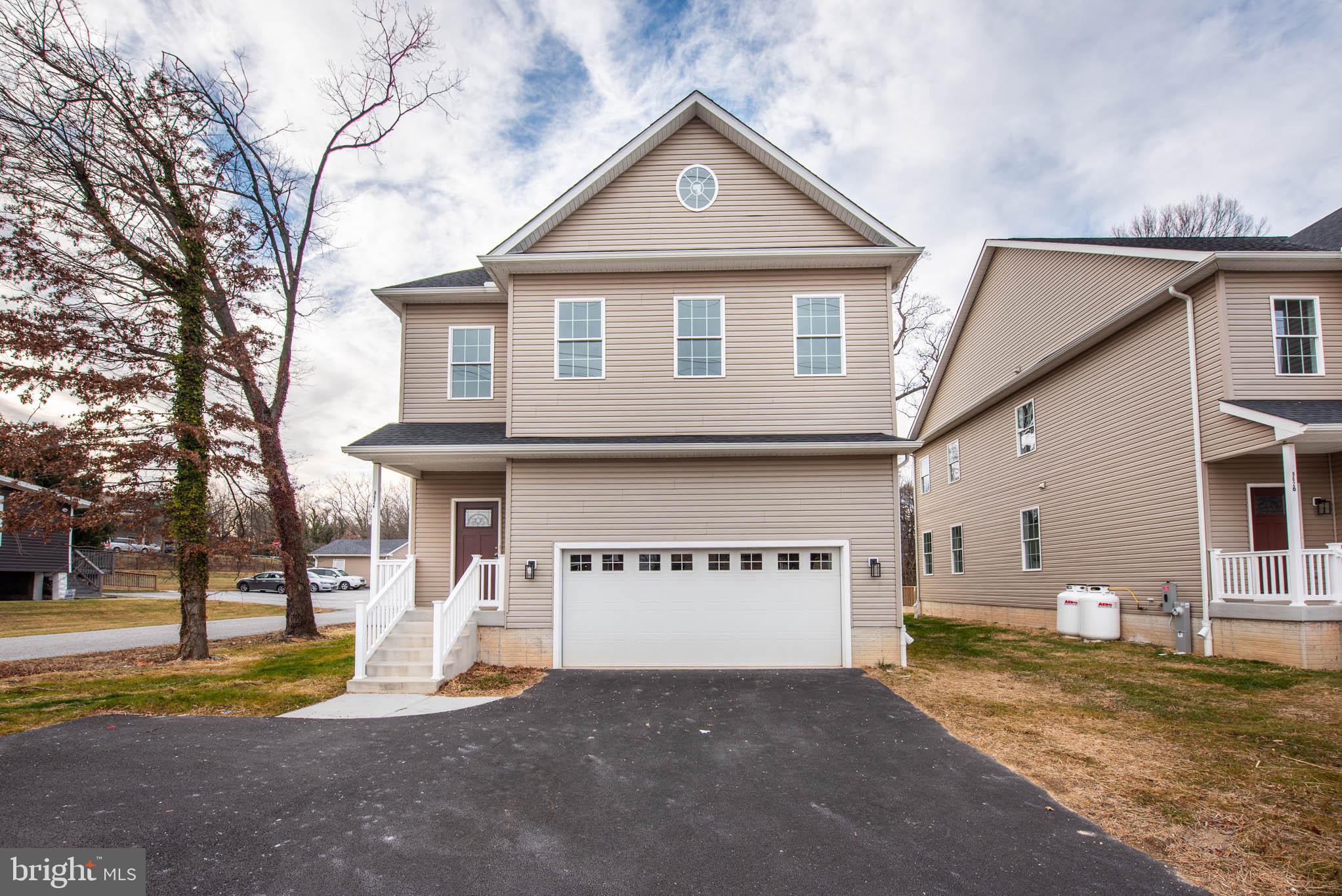 9624 Harford Road Parkville, MD 21234 - Photo 39 of 39 a view of a house with a yard and large tree