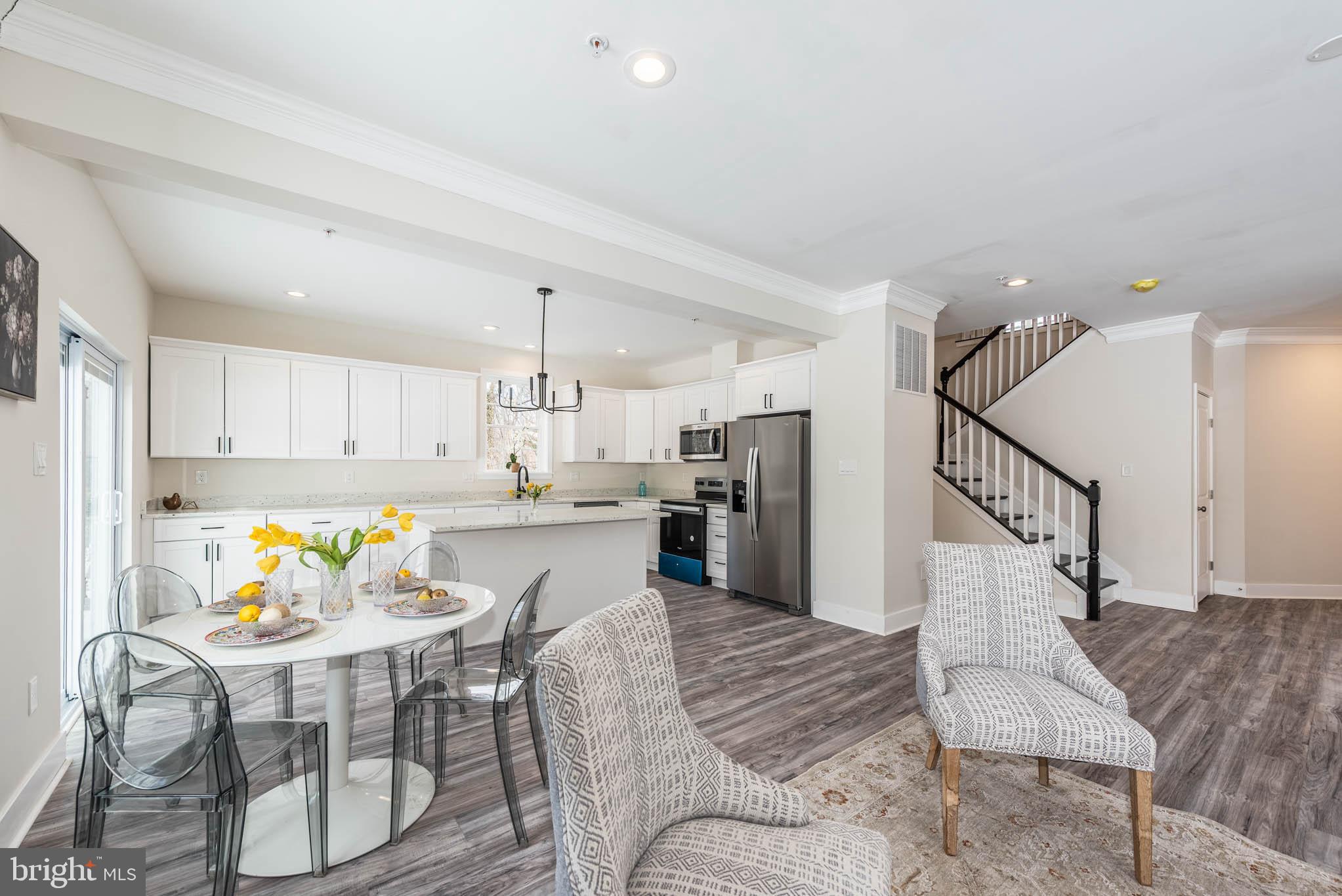 9624 Harford Road Parkville, MD 21234 - Photo 5 of 39 a living room with furniture and kitchen view