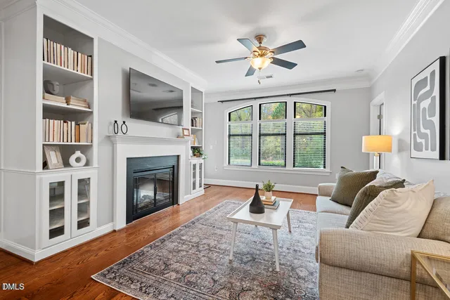 a living room with furniture fireplace and flat screen tv