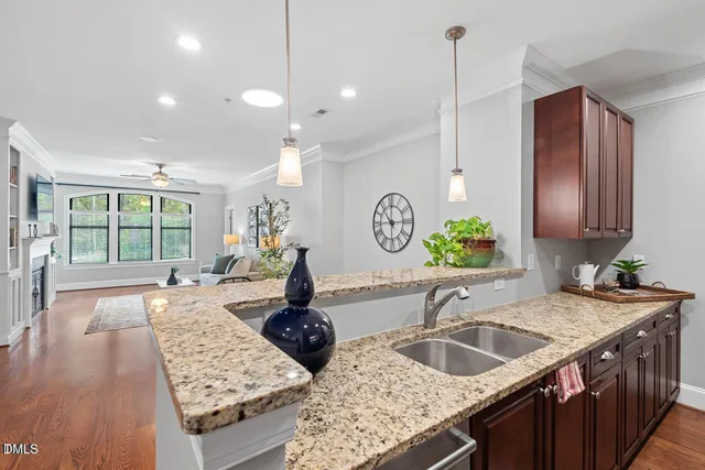 a kitchen with sink stove and wooden cabinets