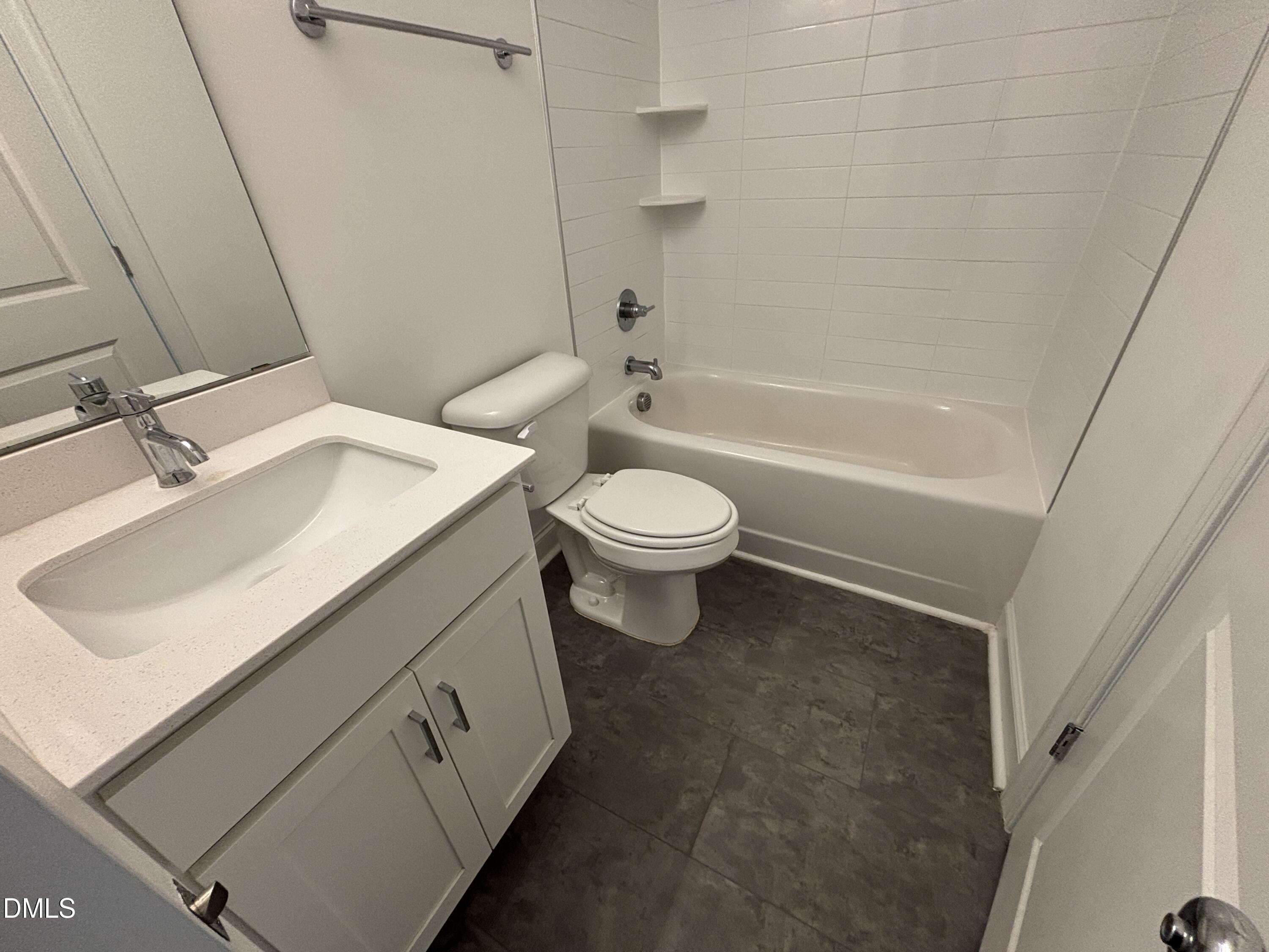 5710 Parker Pnes Court Raleigh, NC 27609 - Photo 58 of 78 a bathroom with a sink a toilet and shower
