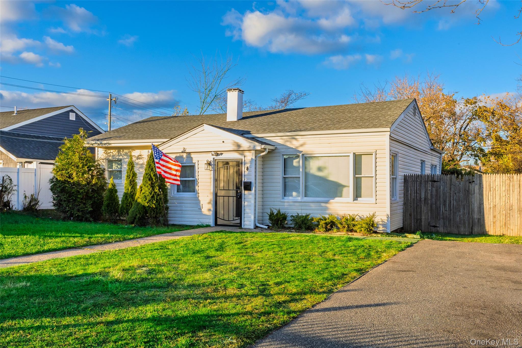 4 North Somerset Road Amityville, NY 11701 - Photo 1 of 1 a front view of a house with a yard