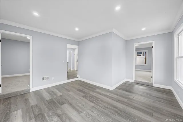 a view of an entryway with wooden floor