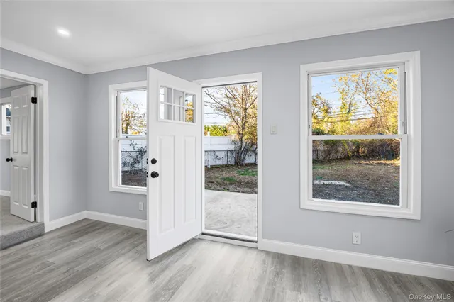 a front view of house with a garden