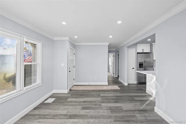 a view of a kitchen with wooden floor
