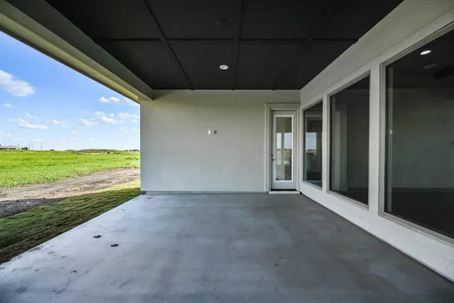 a view of an empty room with a ocean view