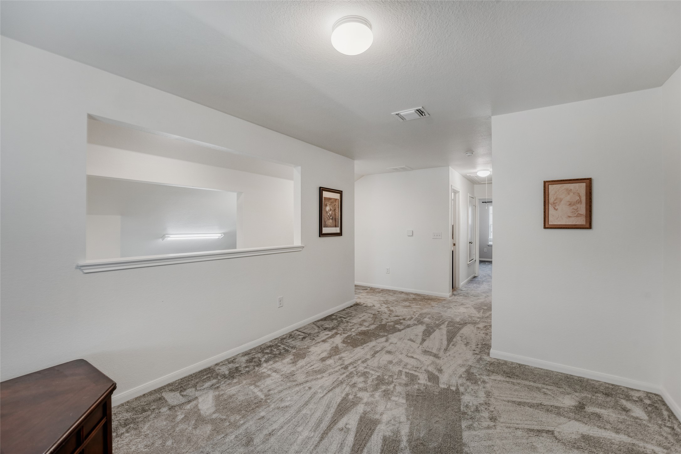 15105 Shell Bark Cove Austin, TX 78724 - Photo 12 of 30 A versatile secondary living space with soft, patterned carpeting awaits your personal touch.