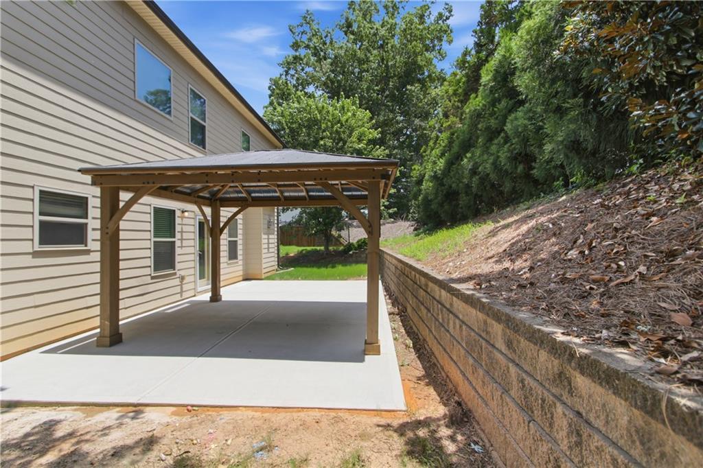 114 Madison Street Canton, GA 30115 - Photo 37 of 39 a view of a house with backyard and wooden fence