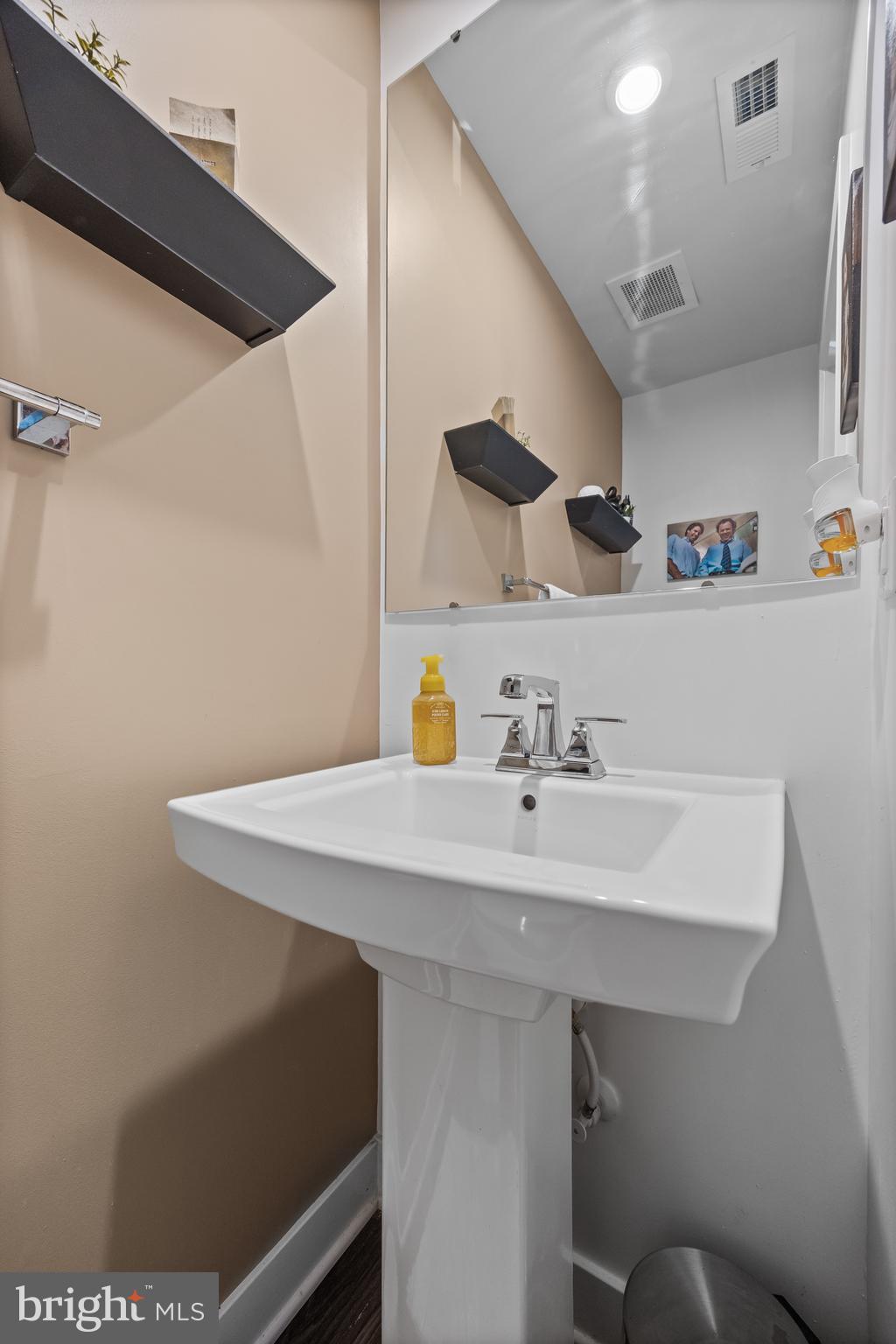 177 Nathan Drive Cinnaminson, NJ 08077 - Photo 11 of 42 a bathroom with a sink a toilet and a mirror