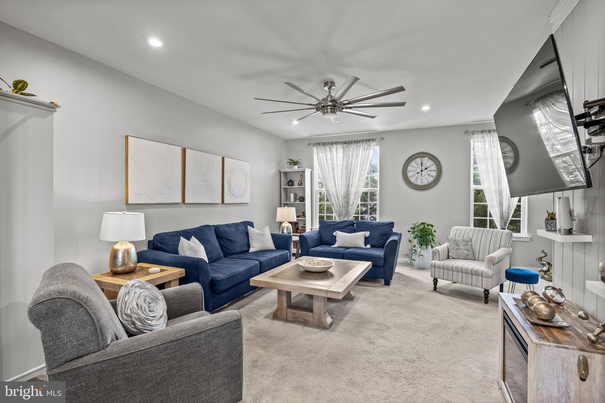 177 Nathan Drive Cinnaminson, NJ 08077 - Photo 12 of 42 a living room with furniture and a clock