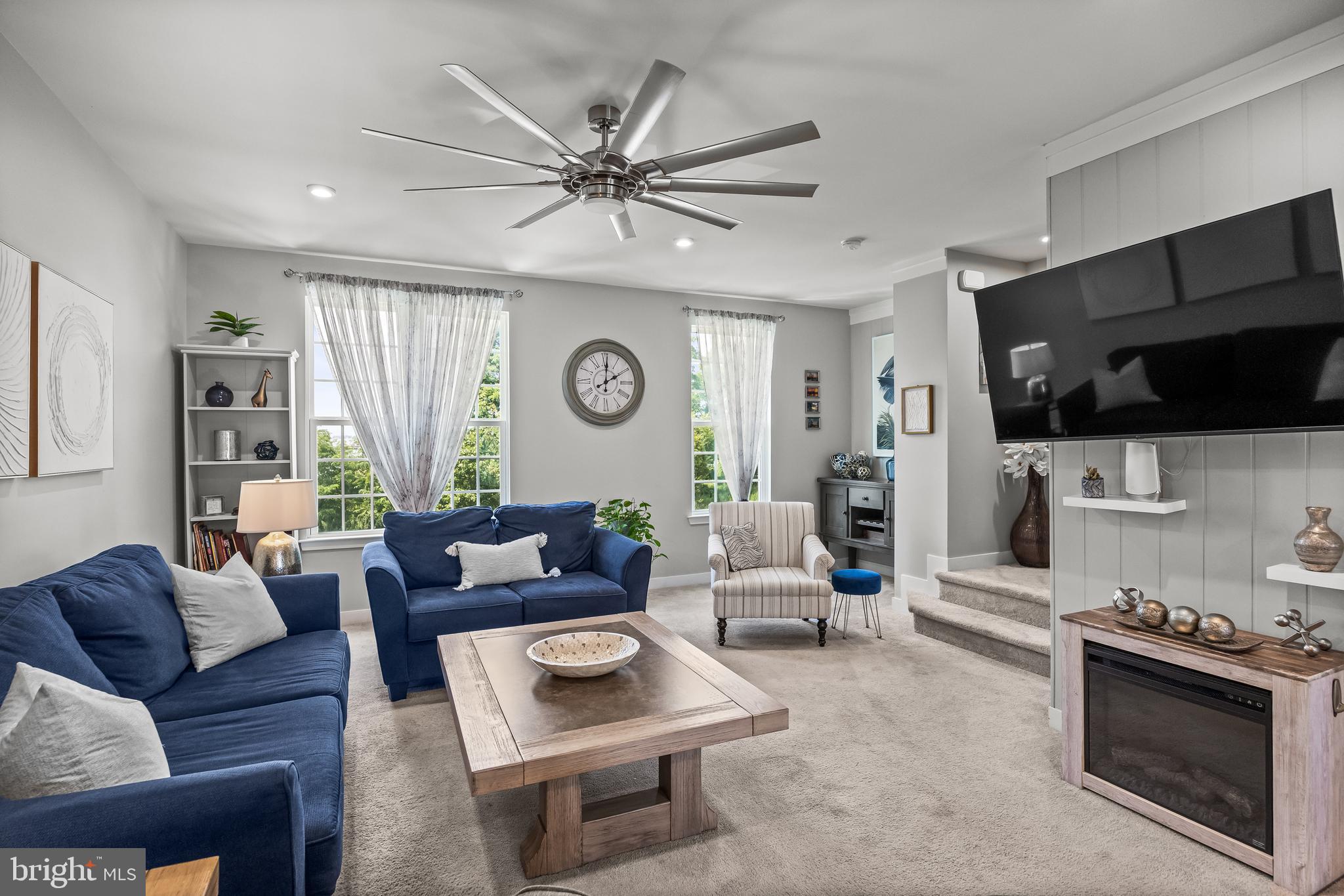 177 Nathan Drive Cinnaminson, NJ 08077 - Photo 14 of 42 a living room with furniture and a flat screen tv