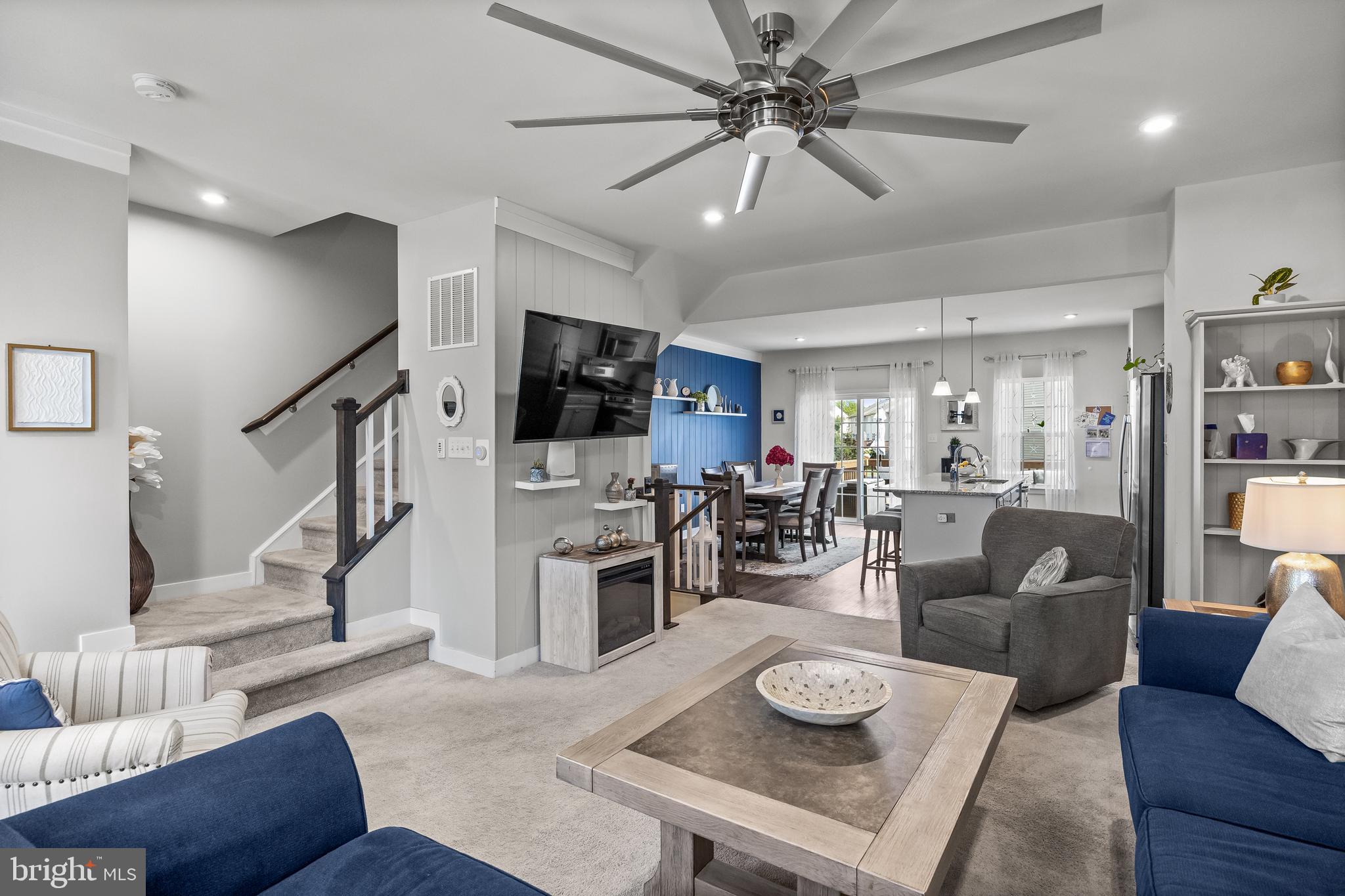 177 Nathan Drive Cinnaminson, NJ 08077 - Photo 16 of 42 a living room with furniture and a flat screen tv with kitchen view