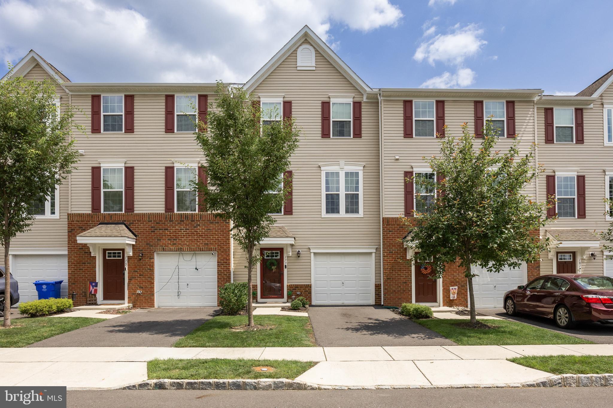 177 Nathan Drive Cinnaminson, NJ 08077 - Photo 2 of 42 a front view of a house with a yard and garage