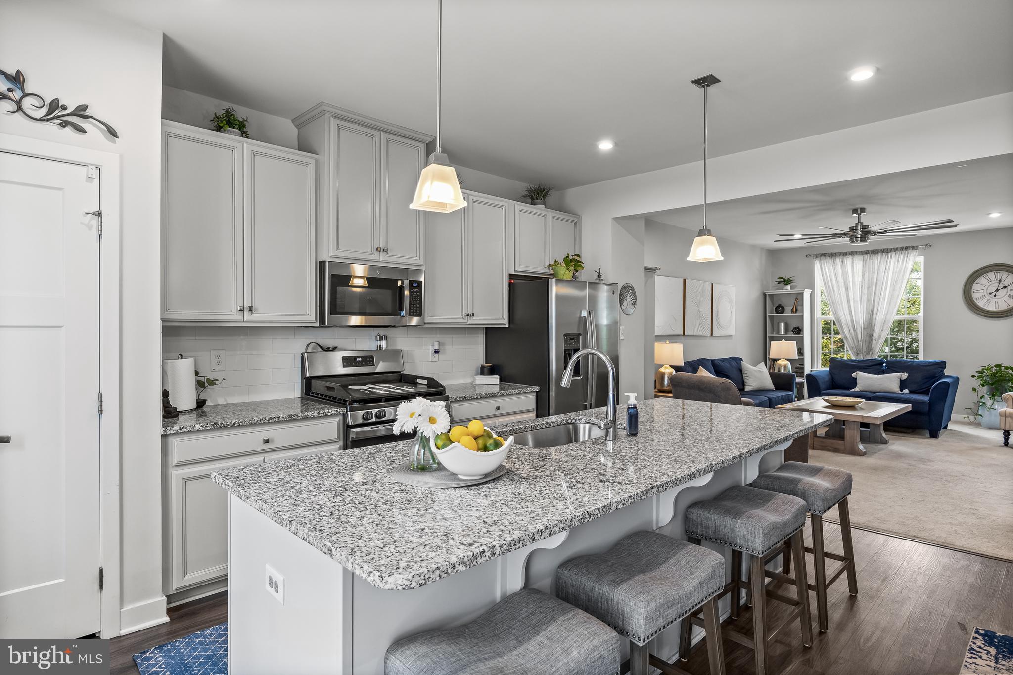 177 Nathan Drive Cinnaminson, NJ 08077 - Photo 21 of 42 a kitchen with a sink a counter space appliances and cabinets