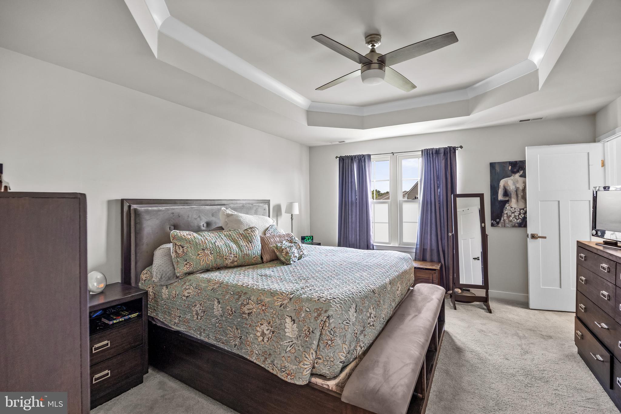 177 Nathan Drive Cinnaminson, NJ 08077 - Photo 23 of 42 a bedroom with a bed dresser and a large window