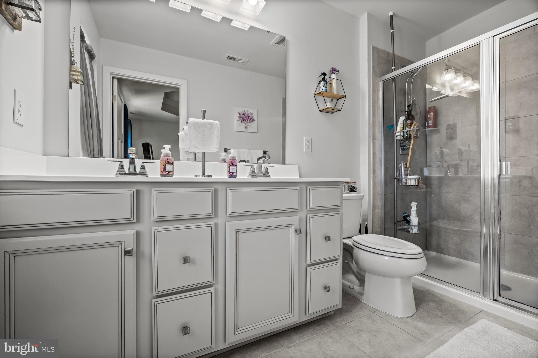 177 Nathan Drive Cinnaminson, NJ 08077 - Photo 26 of 42 a bathroom with a sink toilet and shower