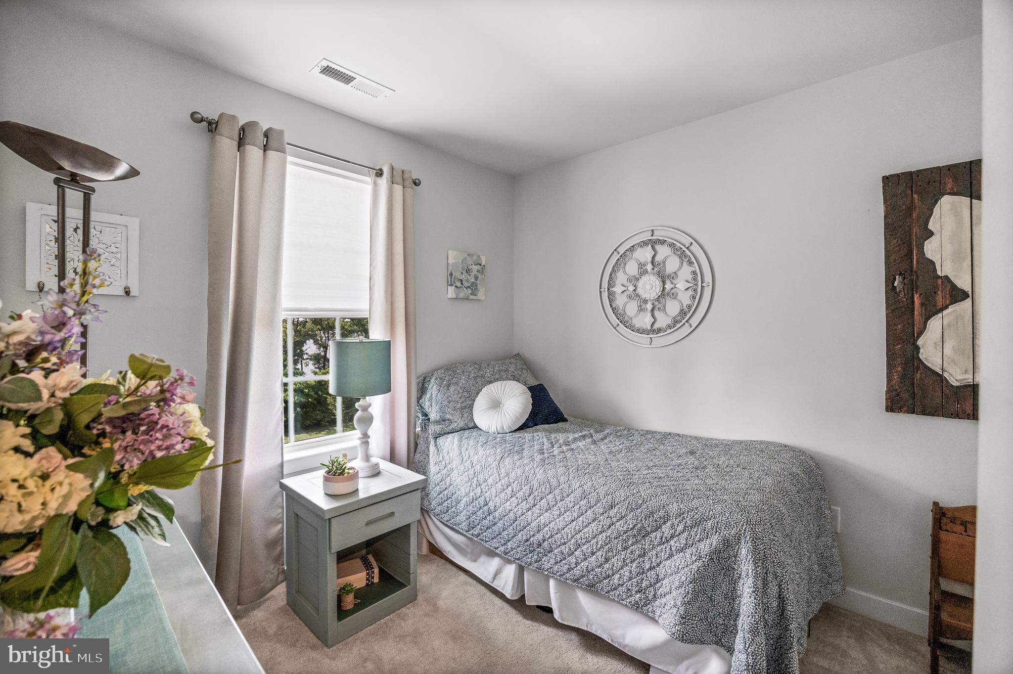 177 Nathan Drive Cinnaminson, NJ 08077 - Photo 28 of 42 a bedroom with a bed mirror and a window