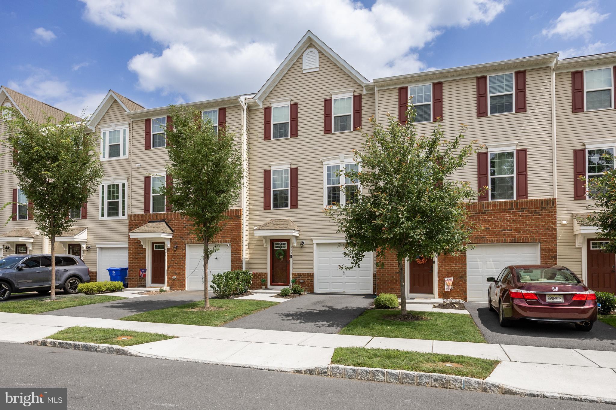 177 Nathan Drive Cinnaminson, NJ 08077 - Photo 3 of 42 a view of a white house in a city street