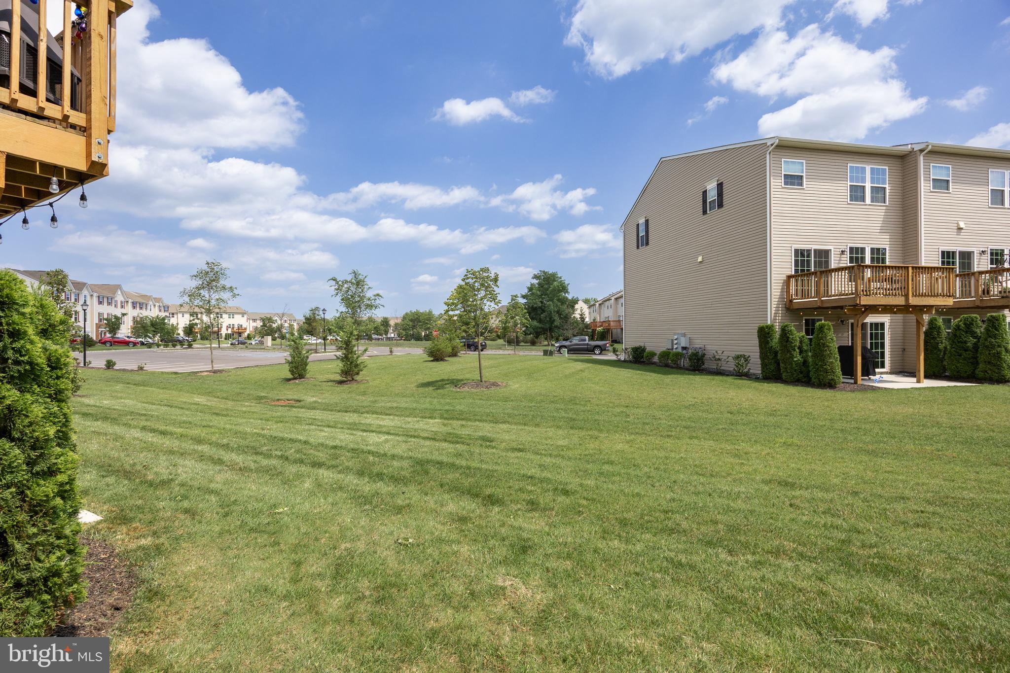 177 Nathan Drive Cinnaminson, NJ 08077 - Photo 34 of 42 a backyard of a house with lots of green space and lake view