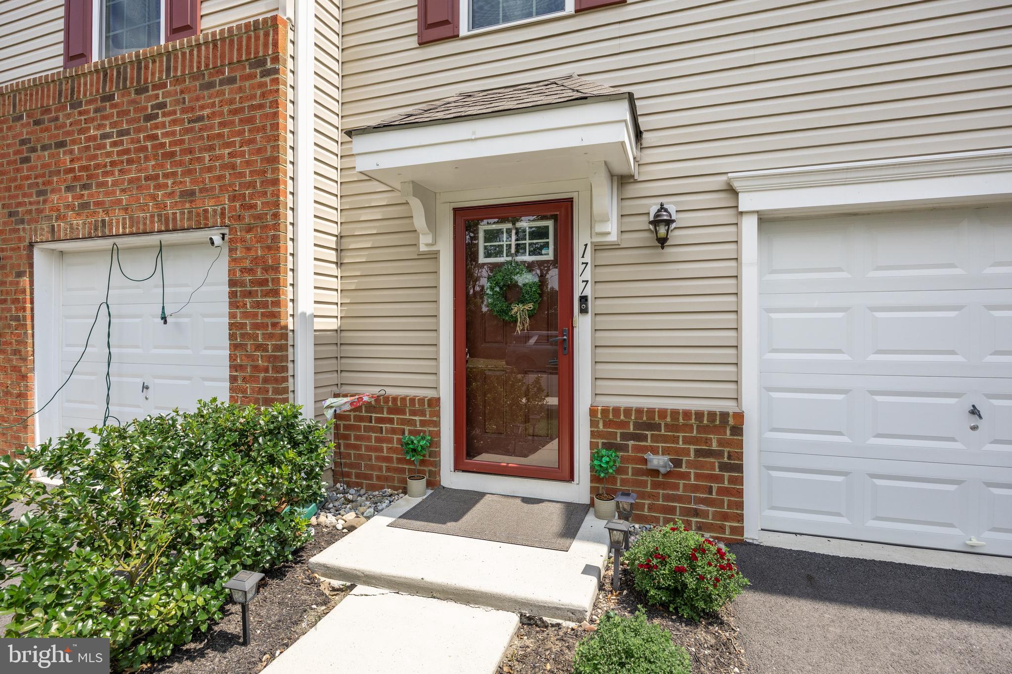 177 Nathan Drive Cinnaminson, NJ 08077 - Photo 5 of 42 a front view of a house with a garage