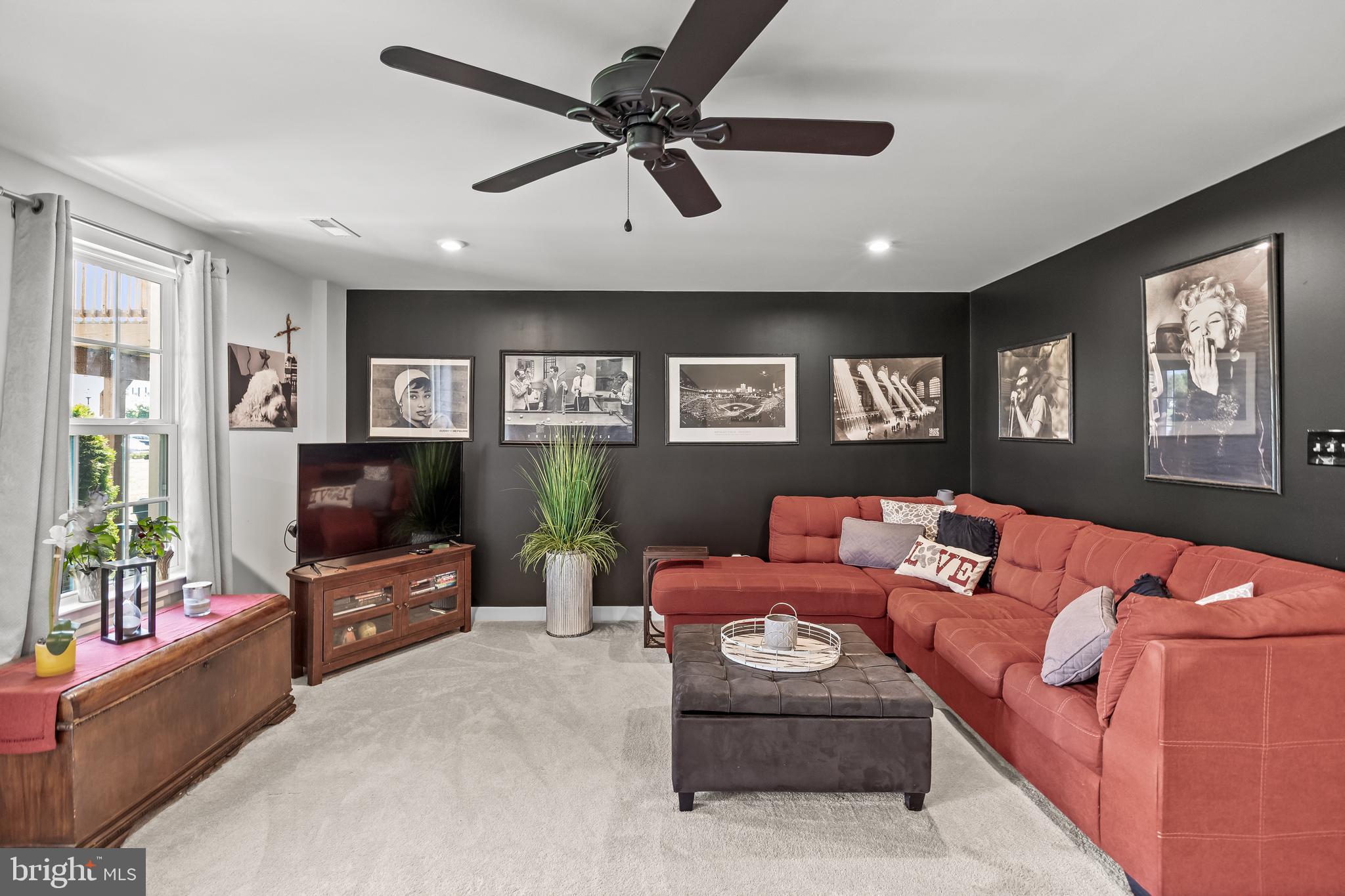 177 Nathan Drive Cinnaminson, NJ 08077 - Photo 8 of 42 a living room with furniture and a flat screen tv