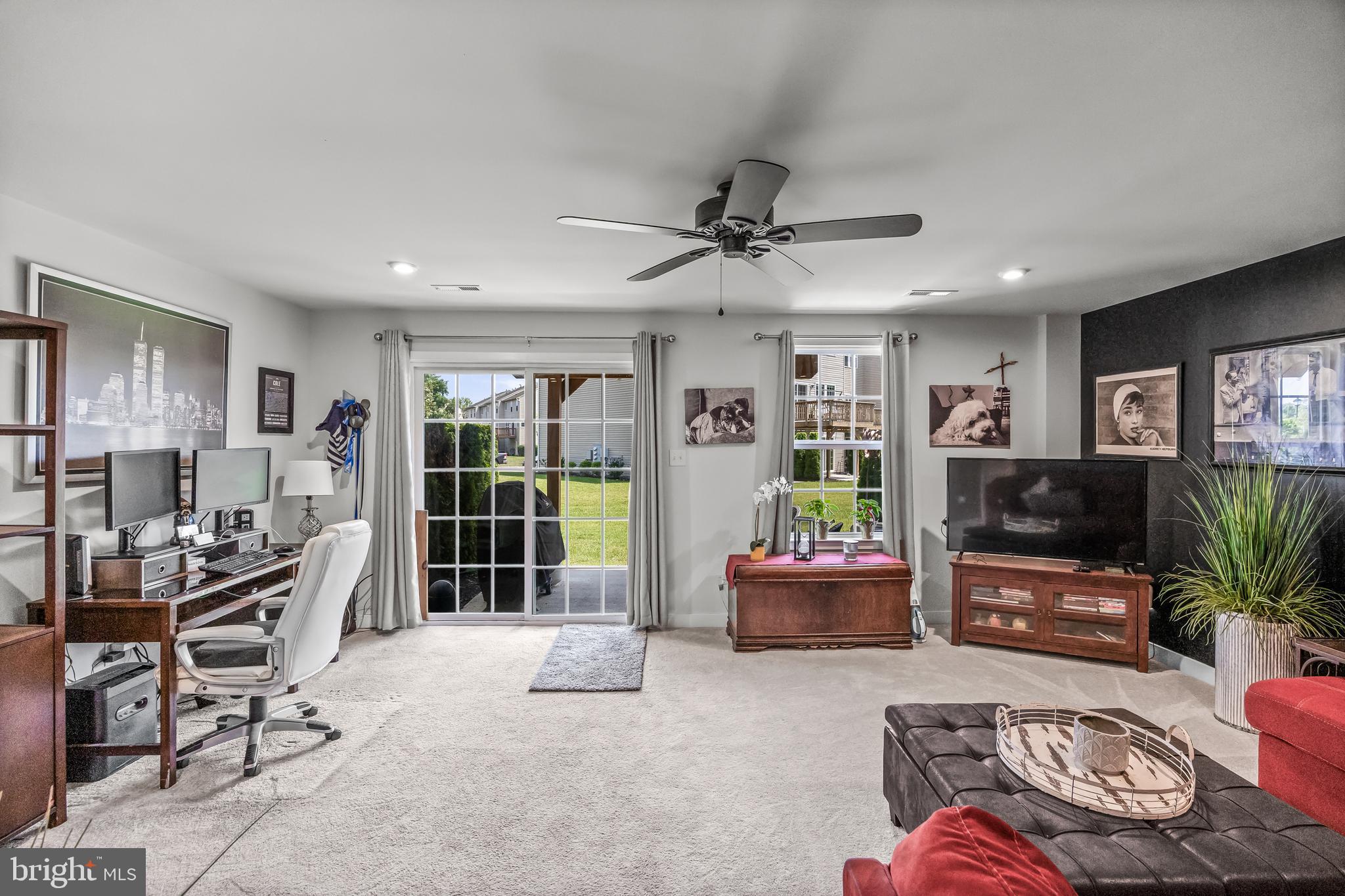 177 Nathan Drive Cinnaminson, NJ 08077 - Photo 9 of 42 a living room with furniture and a flat screen tv