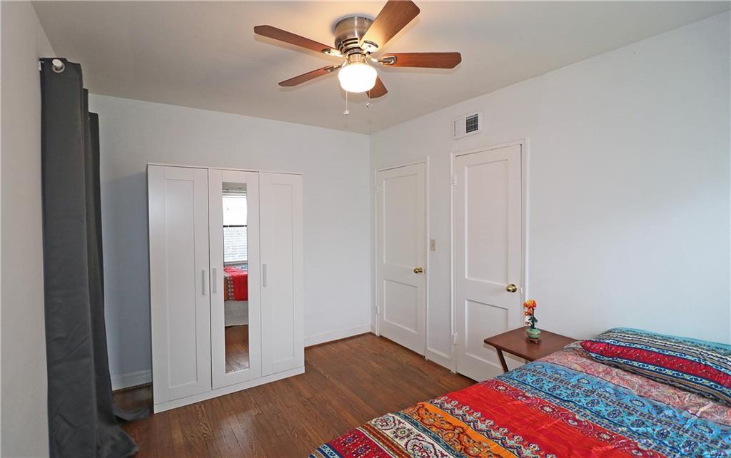 692 Argonne Avenue Northeast, Unit 2 Atlanta, GA 30308 - Photo 12 of 17 a bedroom with bed and a chandelier fan