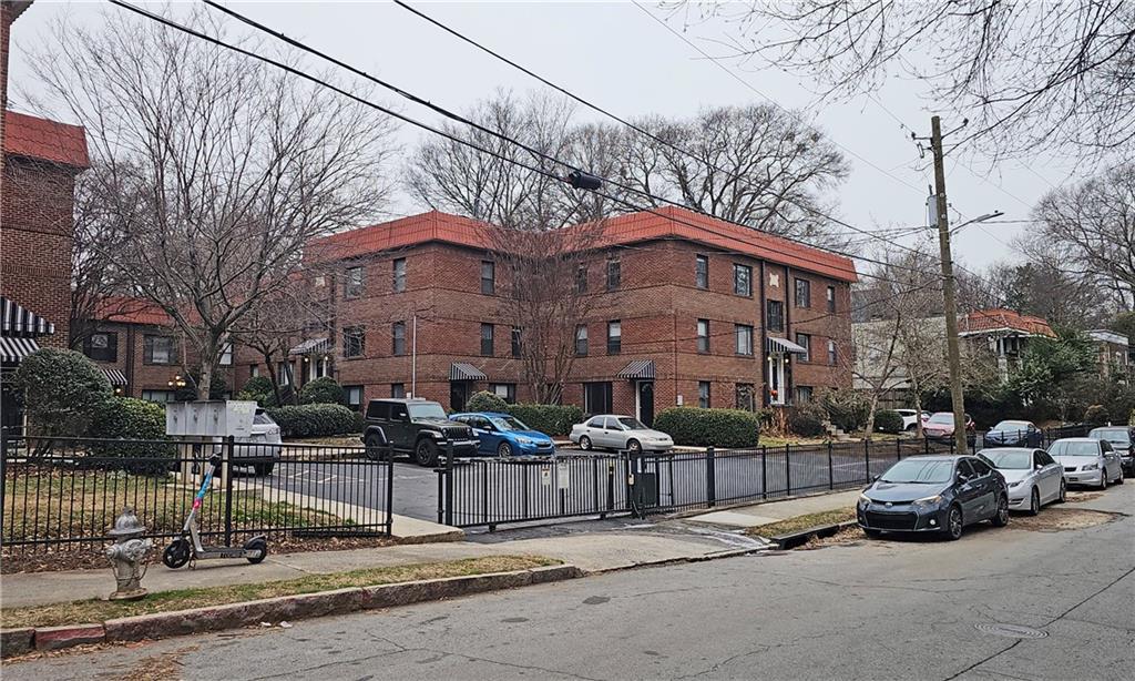 692 Argonne Avenue Northeast, Unit 2 Atlanta, GA 30308 - Photo 16 of 17 a car parked in front of a brick house