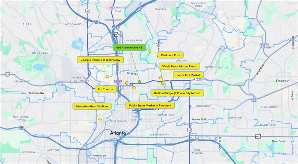 692 Argonne Avenue Northeast, Unit 2 Atlanta, GA 30308 - Photo 17 of 17 a view of a swimming pool with a lawn chairs under an umbrella