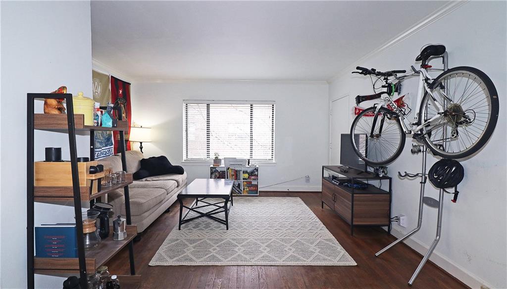 692 Argonne Avenue Northeast, Unit 2 Atlanta, GA 30308 - Photo 3 of 17 a living room with furniture a rug and a window