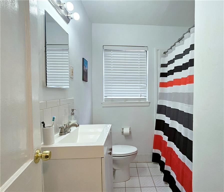 692 Argonne Avenue Northeast, Unit 2 Atlanta, GA 30308 - Photo 10 of 17 a bathroom with a sink toilet and shower