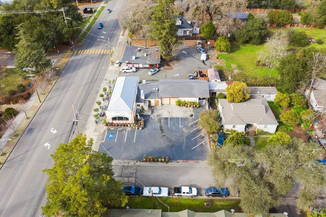 an aerial view of residential houses with outdoor space