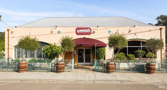 a view of a building with sitting area