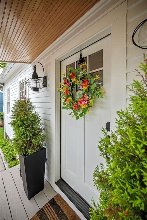 31 Franklin Street Marblehead, MA 01945 - Photo 3 of 35 a house with flowers in front of it