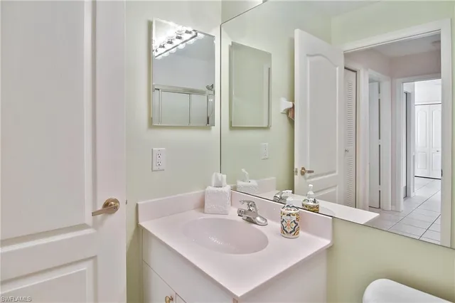 a bedroom with a bed and a table