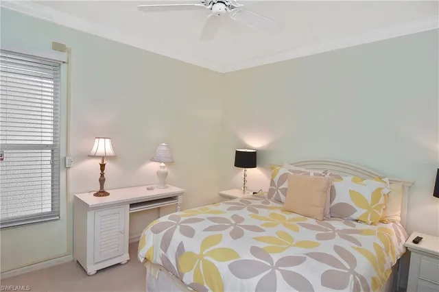 a living room with furniture and a painting on the wall