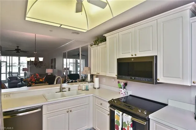 a view of a lake with houses in the background