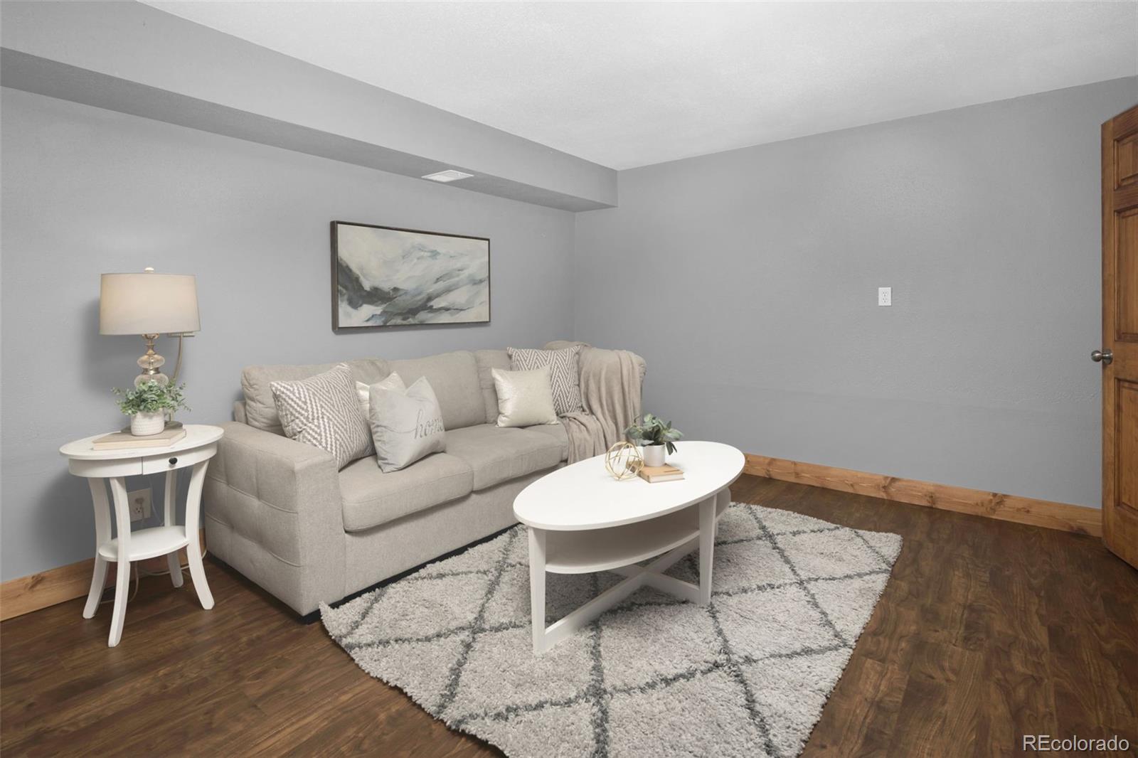 32252 Steven Way Conifer, CO 80433 - Photo 21 of 47 a living room with furniture and a wooden floor