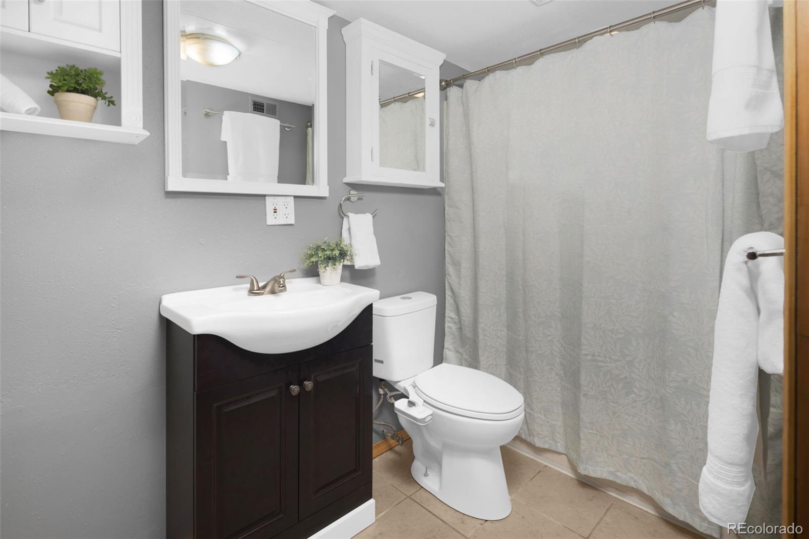 32252 Steven Way Conifer, CO 80433 - Photo 25 of 47 a bathroom with a sink toilet and mirror