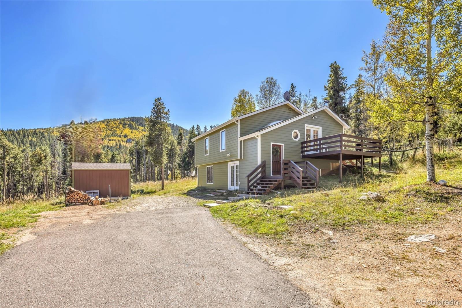 32252 Steven Way Conifer, CO 80433 - Photo 40 of 47 a view of a house with a ocean view