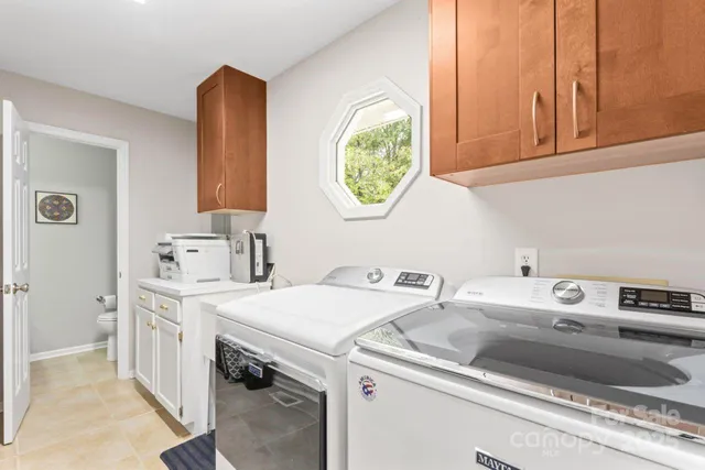 a utility room with dryer and washer