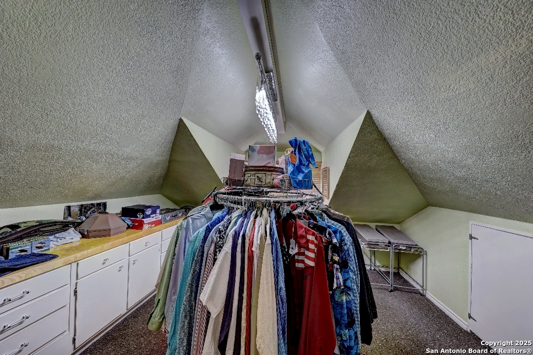 101 North 11th Street Junction, TX 76849 - Photo 16 of 26 a view of walk in closet with clothes and shoes