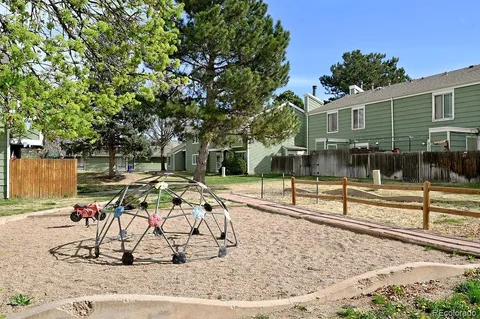 a view of a backyard with sitting area