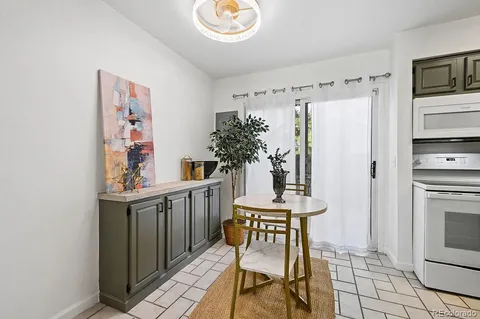 a kitchen with stainless steel appliances a sink and a refrigerator
