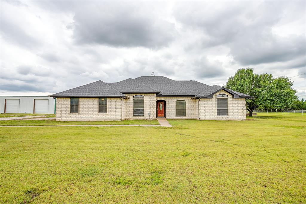 1050 Hampel Road Palmer, TX 75152 - Photo 1 of 35 a front view of a house with a garden