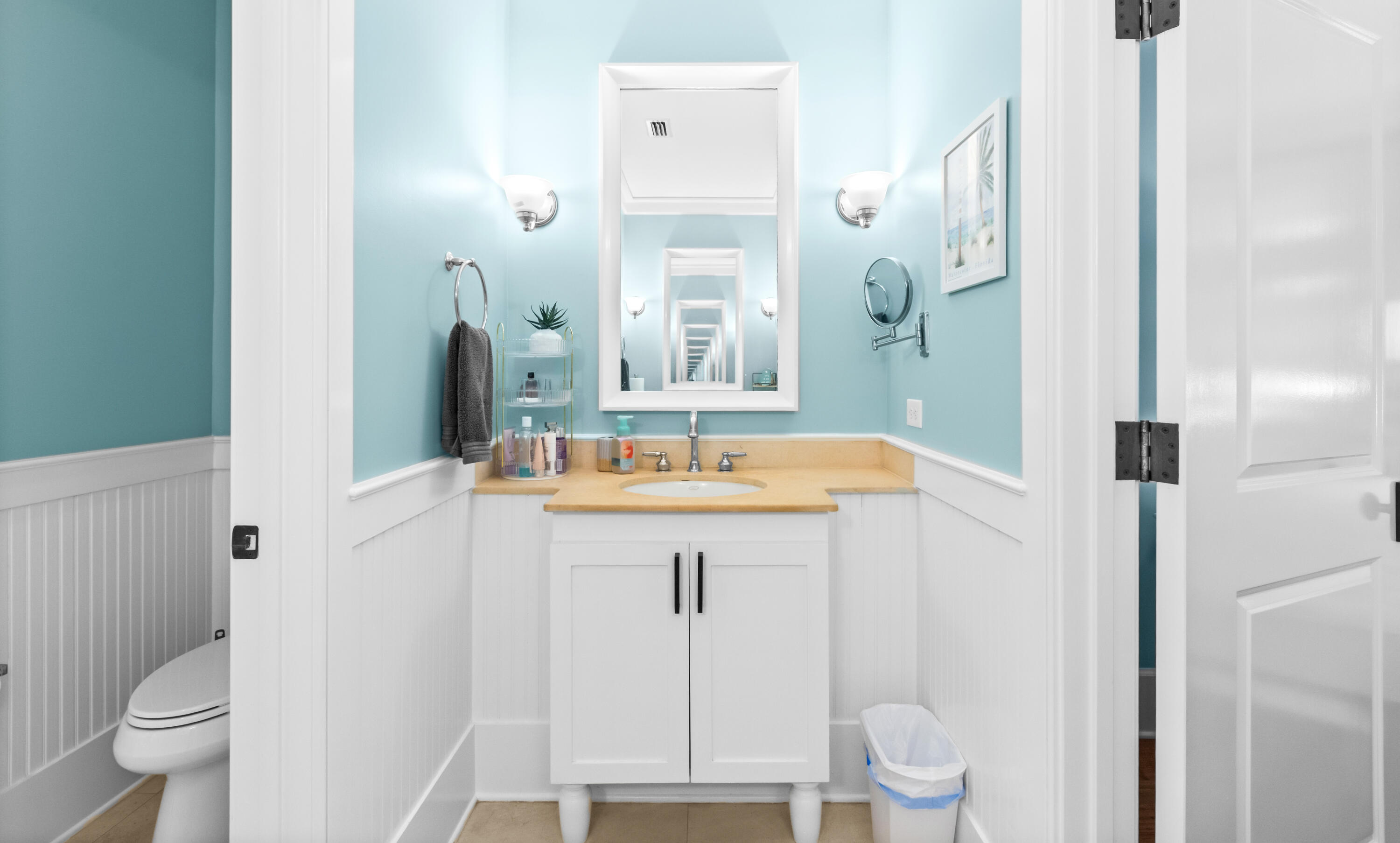 1660 East County Highway 30A, Unit 101 Santa Rosa Beach, FL 32459 - Photo 20 of 67 a bathroom with a sink a toilet and a mirror