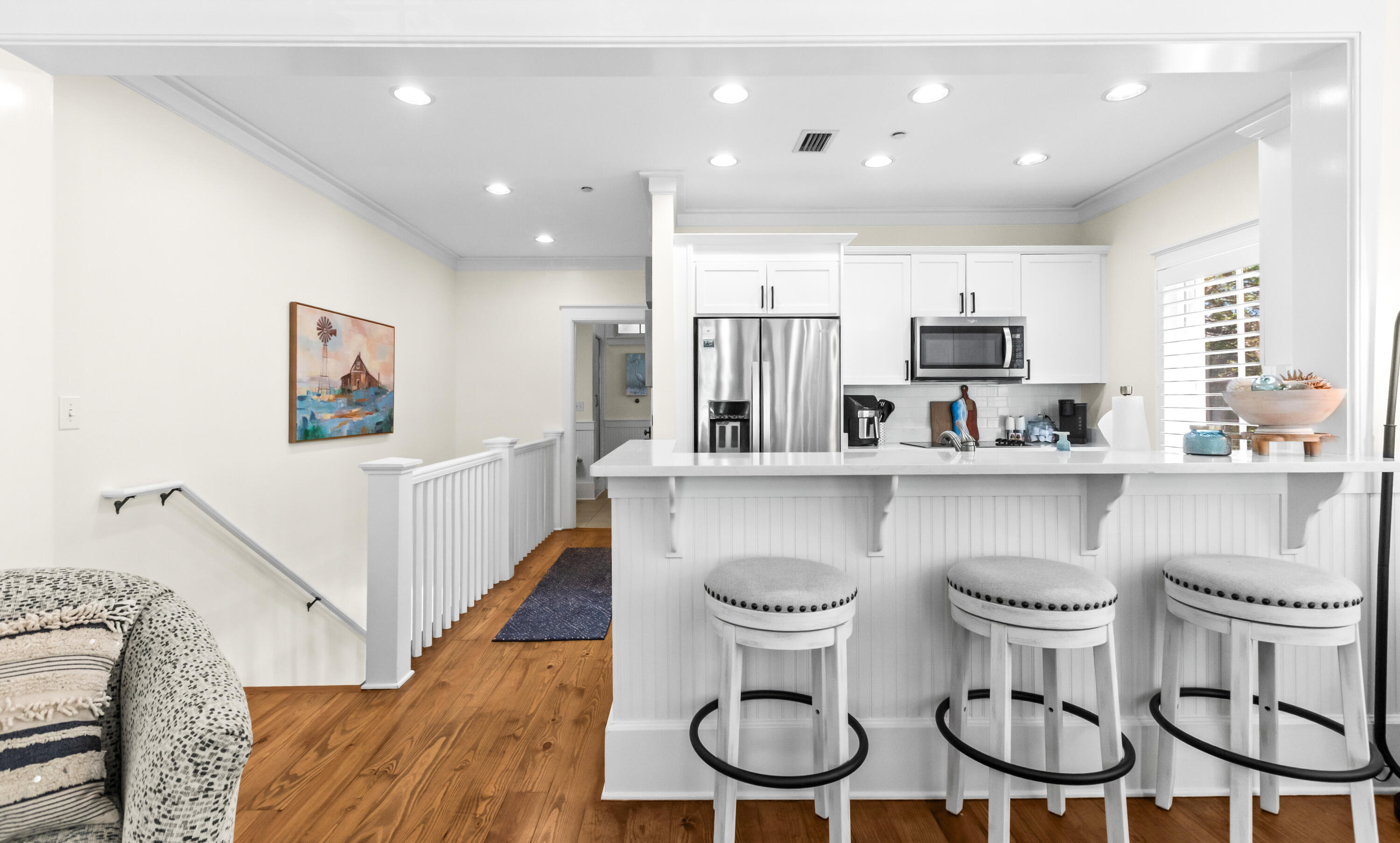 1660 East County Highway 30A, Unit 101 Santa Rosa Beach, FL 32459 - Photo 35 of 67 a kitchen with stainless steel appliances a table and chairs