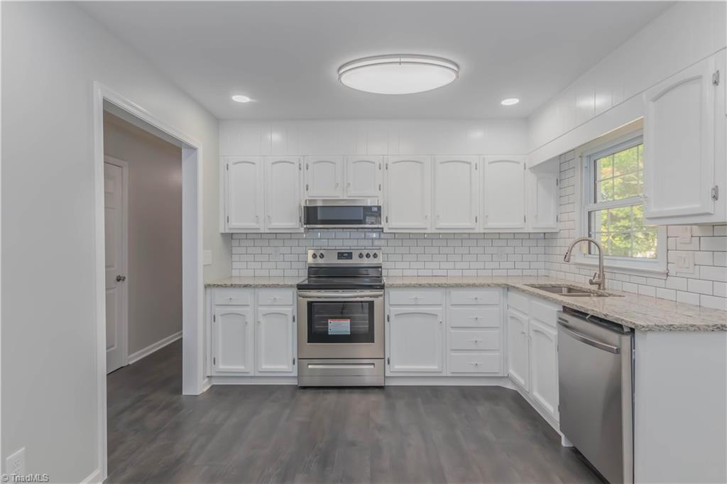 3206 Dillon Road Jamestown, NC 27282 - Photo 13 of 30 New granite countertop and newly painted cabinets.