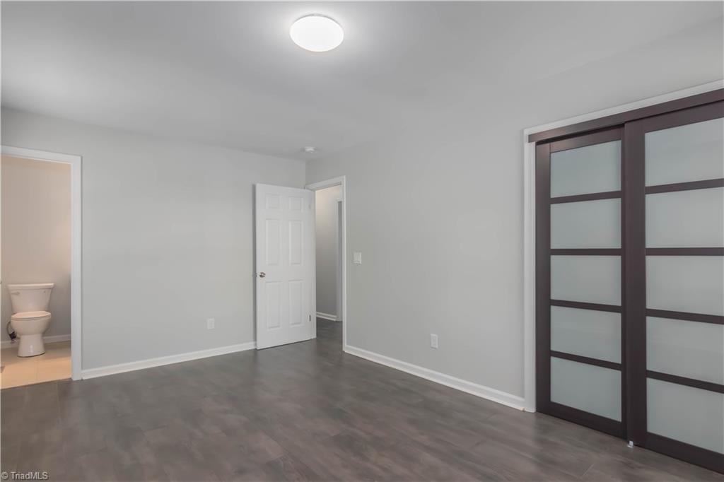 3206 Dillon Road Jamestown, NC 27282 - Photo 22 of 30 Master bedroom with sliding closet doors.