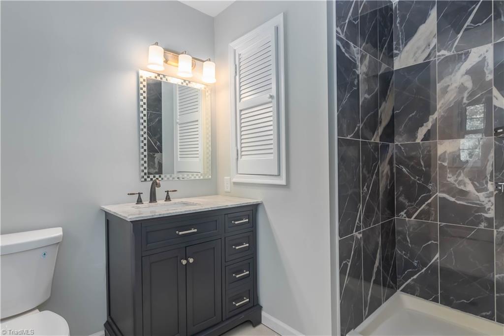 3206 Dillon Road Jamestown, NC 27282 - Photo 23 of 30 All new guest bathroom with tiled walk-in shower.